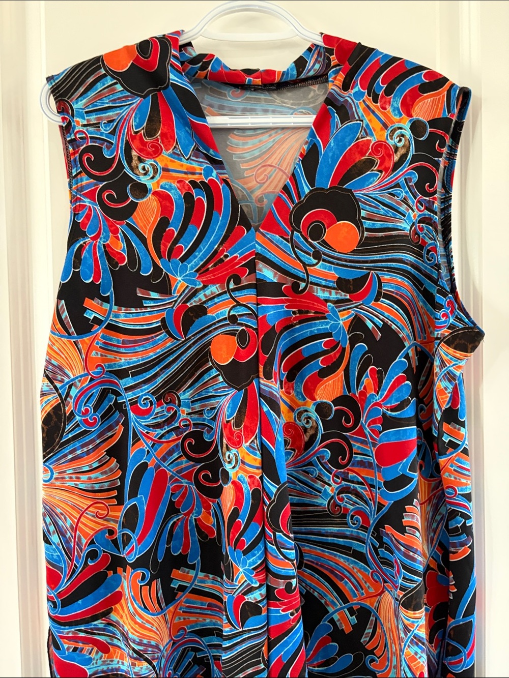 Sleeveless V-Neck Blouse in Black with Blue & Red Swirl Print